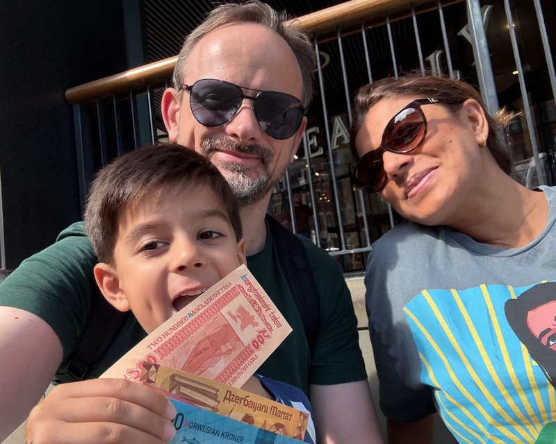 Family team playing Race Across The World: The Experience in London