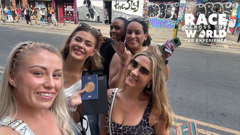 Team playing Race Across the World: The Experience posing for a photograph in Manchester