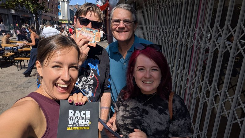 Team playing Race Across the World: The Experience posing for a photograph in Manchester