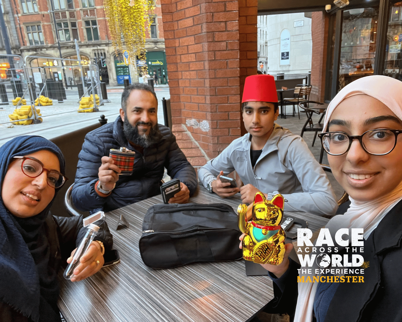 Team completing physicall puzzle on Race Across The World the experience