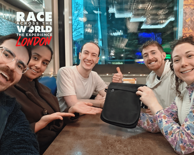 Team-posing-with-bag-race-across-the-world-experience