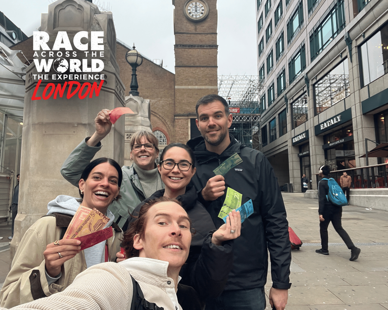 team-posing-with-money-race-across-the-world-experience